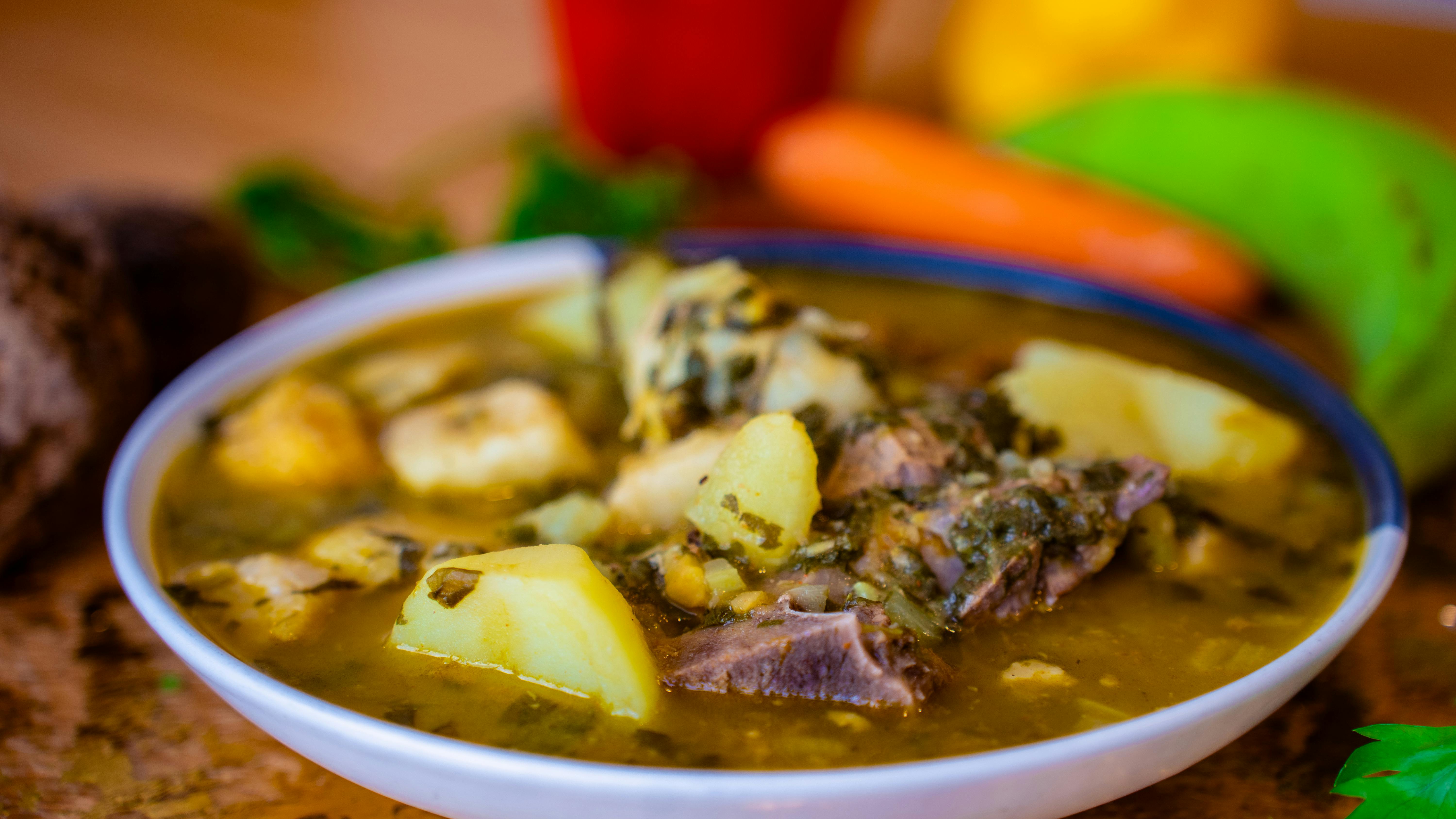 beef stew in pot with herbs